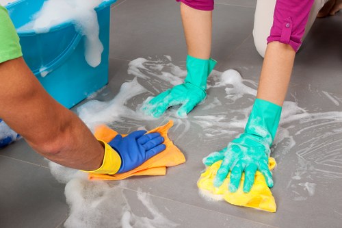 Carpet cleaning technician preparing safe equipment for a home service