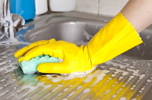 Professional carpet cleaner working carefully with trained methods